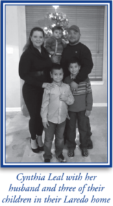 Cynthia Leal with her husband and three of their children in their Laredo home